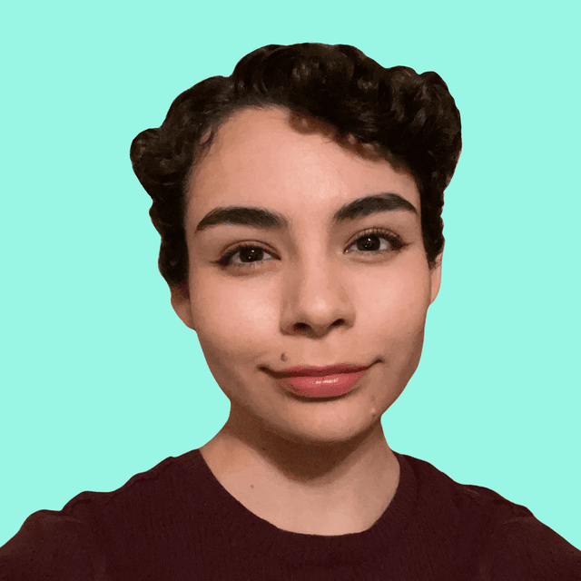 Headshot of Tanya, a Mexican-American person wearing a smile and a burgundy shirt.